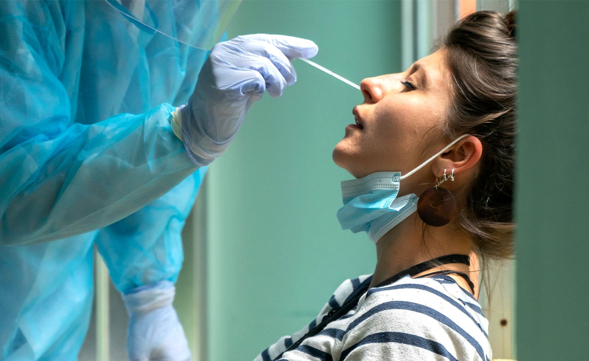 A woman undergoes COVID-19 swabbing. The world’s health systems have had to quickly ramp up testing.