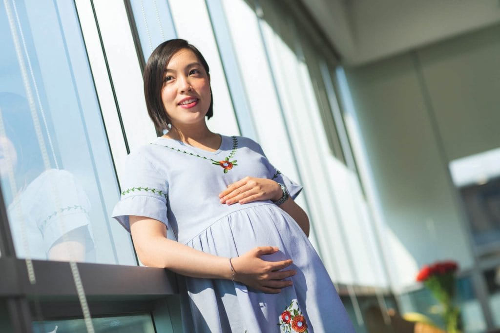 Portrait of a 22-week pregnant  Jintarat Taamsri featured in Roche Diagram healthcare magazine publications